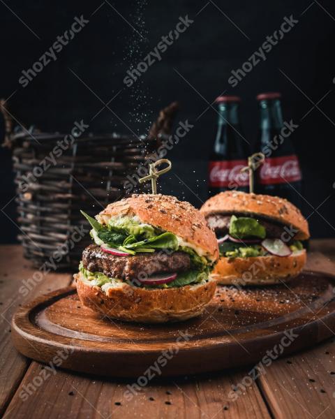 Hamburgers on wooden board with coke